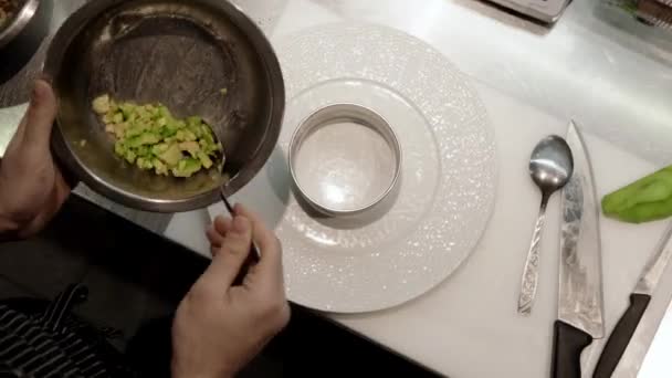 Hands Chef Putting Fresh Cut Pieces Avocado Form Big White — Stock Video