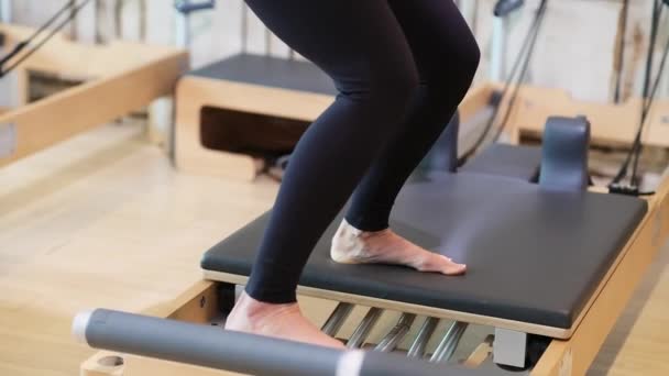 Intensive Pilates Workout Modern Studio Woman Sportswear Strengthening Leg Muscles — Stock Video