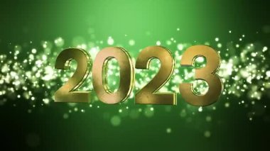 Noel 'in video animasyonu altın ışık parçacıkları yeşil zemin üzerinde parlıyor ve 2023 rakamları yeni yılı temsil ediyor - tatil kavramını.