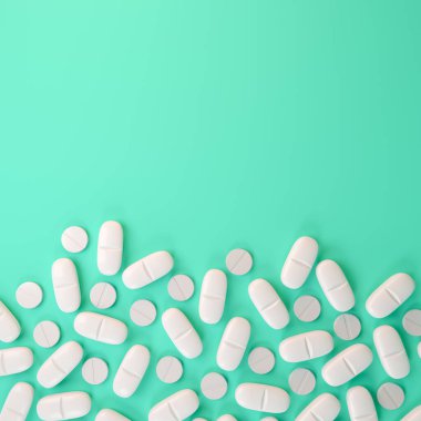 Beyaz tabletler, haplar - yeşil arka planda ilaç.
