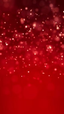 Kırmızı arkaplan üzerinde altın ışık parçacıklarının video animasyonu - soyut parçacıklar arka plan - dikey video