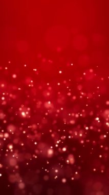 Altın ışık parçacıklarının dikey video animasyonu kırmızı arkaplan üzerinde bokeh - soyut parçacıklar arka plan.