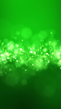 Altın ışık parçacıklarının dikey video animasyonu yeşil arkaplan üzerinde bokeh - soyut parçacıklar arkaplan.