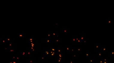 Siyah zemin üzerinde, turuncu ve kırmızı büyük parçacıklar parlayan ateş parçacıkları