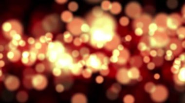 Renkli bokeh arkaplanının soyut parçacıkları. Sıcak tonlarda şenlikli arkaplan, 4k 'de parçacık animasyonu