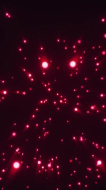 Merkezden yayılan kırmızı parçacıklar koyu kırmızı bir ortam arkaplanındalar. Dinamik, enerjik hareket etkisine sahip dikey biçim.