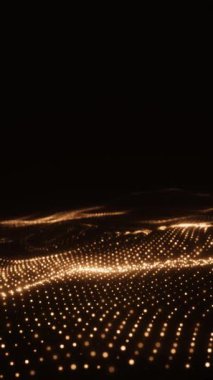 Parlayan parçacıkların altın dalgaları siyah üzerine parlak bir yüzey oluşturur. 4k 'da zarif soyut animasyon