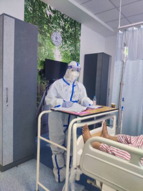 Jaipur, India Circa 2022: Picture of doctors wearing PPE kit working in Covid Ward. Corona virus covid-19. Healthcare workers