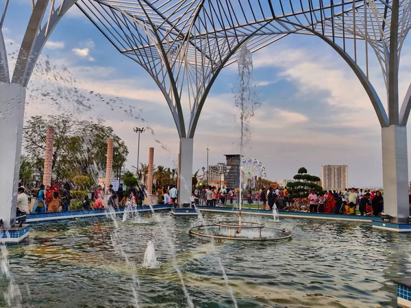 stock image Jaipur, India Circa 2023: Picture of water droplets coming out of a fountain shot in City Park in Mansarovar. Picture is shot in evening during sunset against blue sky