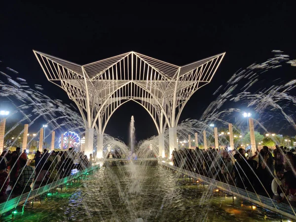 stock image Jaipur, India Circa 2023: Picture of water droplets coming out of a fountain with a monument in background shot in City Park in Mansarovar at night