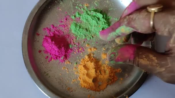 Footage Colorful Holi Powder Hand Shot Holi Color Plate Background — Stock Video