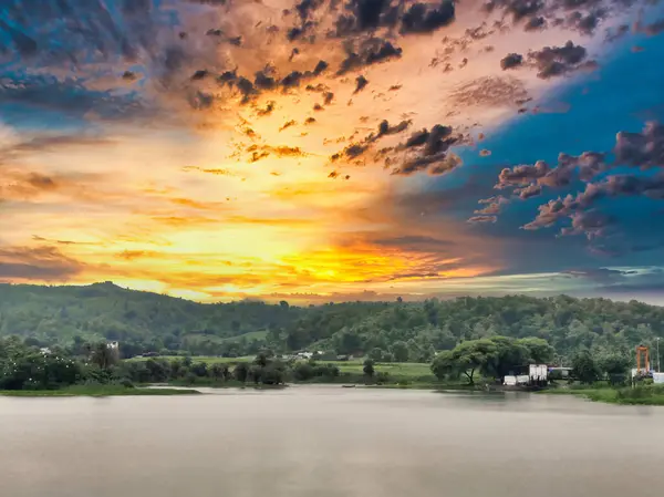 stock image Banswara, Rajasthan, India 9 August 2024:Landscape shot of bank side of a river shot against a beautiful sunset