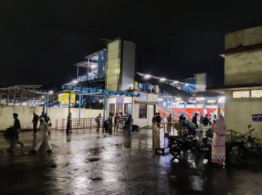 Ratlam, Madhya Pradesh, India 9 August 2024: Picture of crowd at Ratlam Junction railway station shot at night clipart