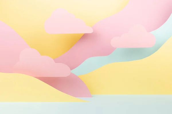 Fantasy cartoon landscape as abstract scene mockup with paper pink clouds, mountains in pink, yellow, mint color. Background for advertising, design, card, presentation of cosmetic, goods, poster.