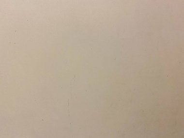 Beton bir duvardaki eski boya, desenli ve sanatsal beyaz bir zemin oluşturuyor..