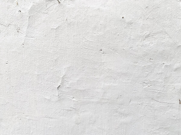 Closeup of a vintage concrete wall with a stucco finish.