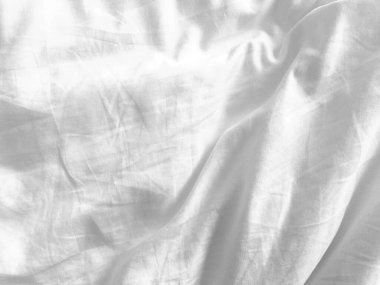 Bu beyaz kumaş arka planının boş alanı, yaratıcılığı ve zanaatkarlığı sergilemek için çok yönlü bir tuval sağlayan tasarımcılar için temiz bir sayfa sunar..