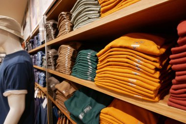 Close up of Colorful Shirts on shelf in a shop ,