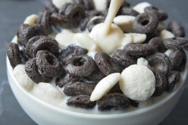 chocolate corn flakes in a bowl on table ,