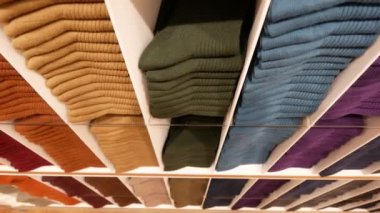 Close up of Colorful Shirts on shelf in a shop ,