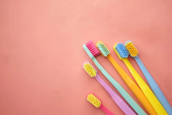 Colorful Toothbrushes Pink Background Top View — Stock Photo, Image