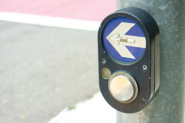 close up of crossing signal button in singapore .