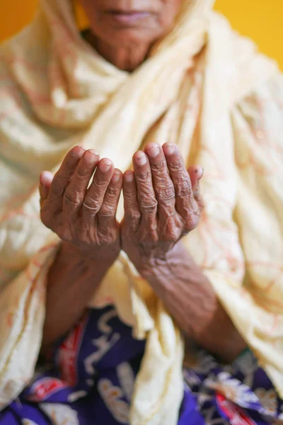 stock image Close up of senior women hand praying at ramadan .