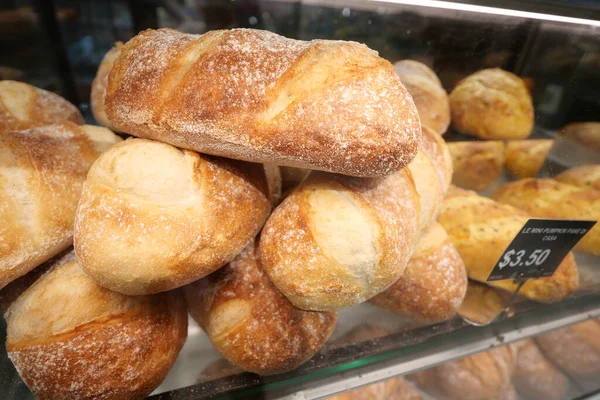 stock image Baked pastry with glass window in the bakery 