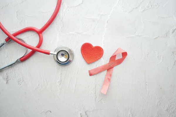 Red Ribbon Hiv Stethoscope Pink Background — Stock Photo, Image