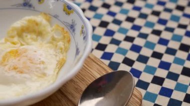 Fried eggs in the plate close up ,,