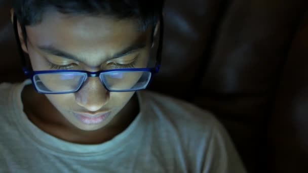 Teenage Boy Sitting Sofa Using Smart Phone Night — Stockvideo