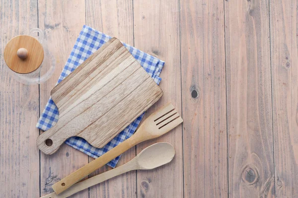 wooden chopping board on table top down .