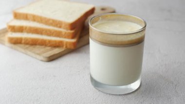 glass of whole cream milk on table , 