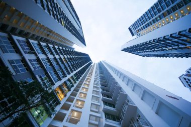 low angle view of signapore residential buildings against blue sky ,