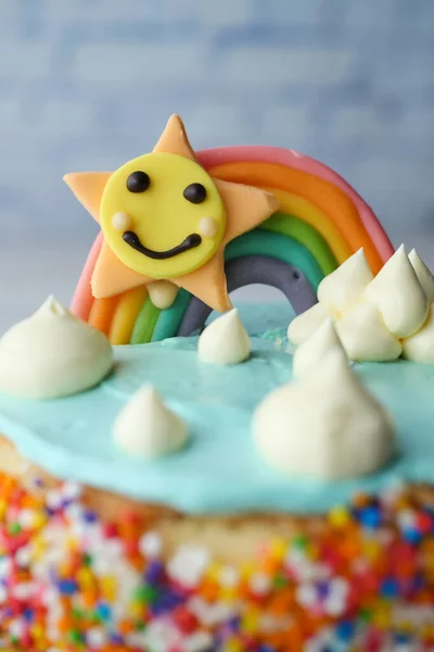 rainbow color birthday cake on table ,