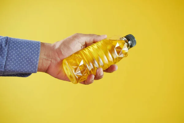yellow sunflower oil bottle on table .
