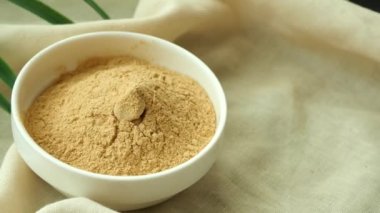 brewers yeast flakes in a bowl on table .