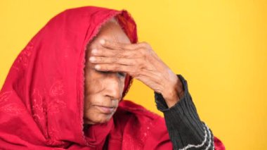 senior asian women suffering headache.