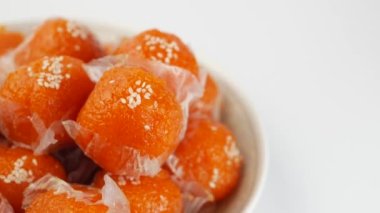 laddu motichoor in a bowl on white background .