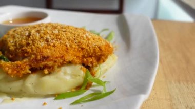 fish fillet , mash potato on a plate ,