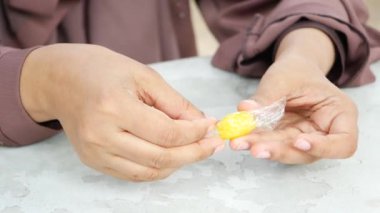 removing packet from a chocolate .