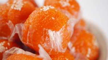 laddu motichoor in a bowl on white background .