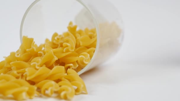 Uncooked Dry Pasta Spilling Container White — ストック動画