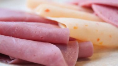  smoked meat plate with sliced ham, bacon .