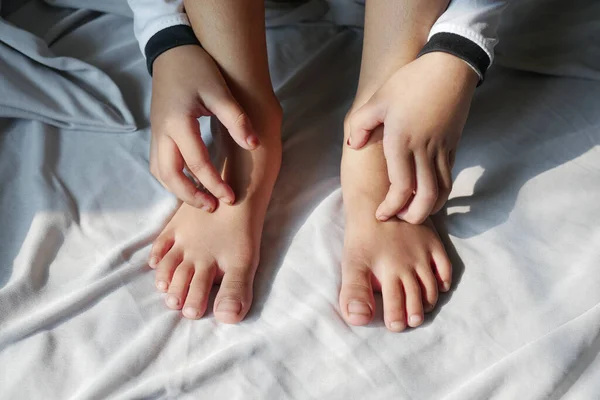 stock image  child girl suffering from itching skin, close up..