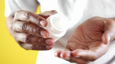 young men taking medical pill .