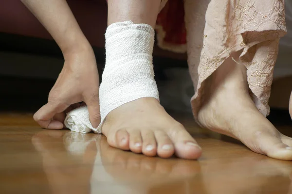 Woman with bandaged foot close up ,