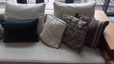 modern grey sofa with pillows in living room at home. High quality photo