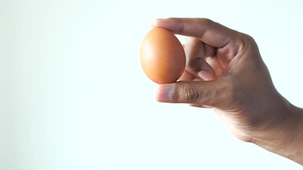 Men Holding Egg White Background — Stok video