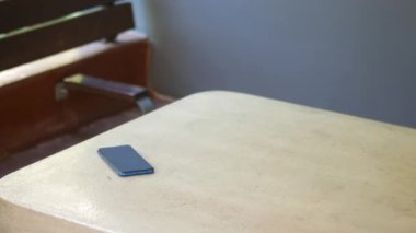 forget smartphone on a park bench, lost smart phone ,